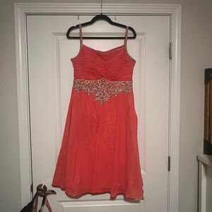 Elegant Coral Dress with Embellished Waist